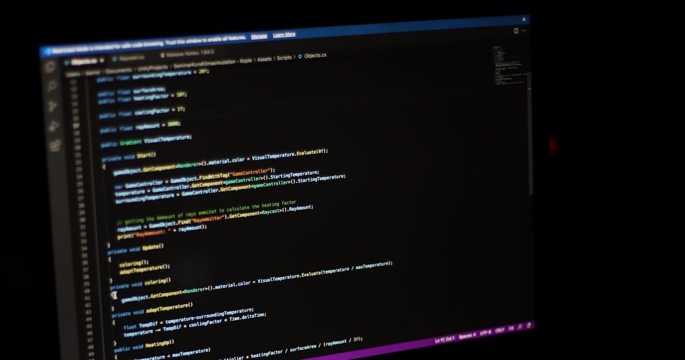Laptop displaying Python code for automation